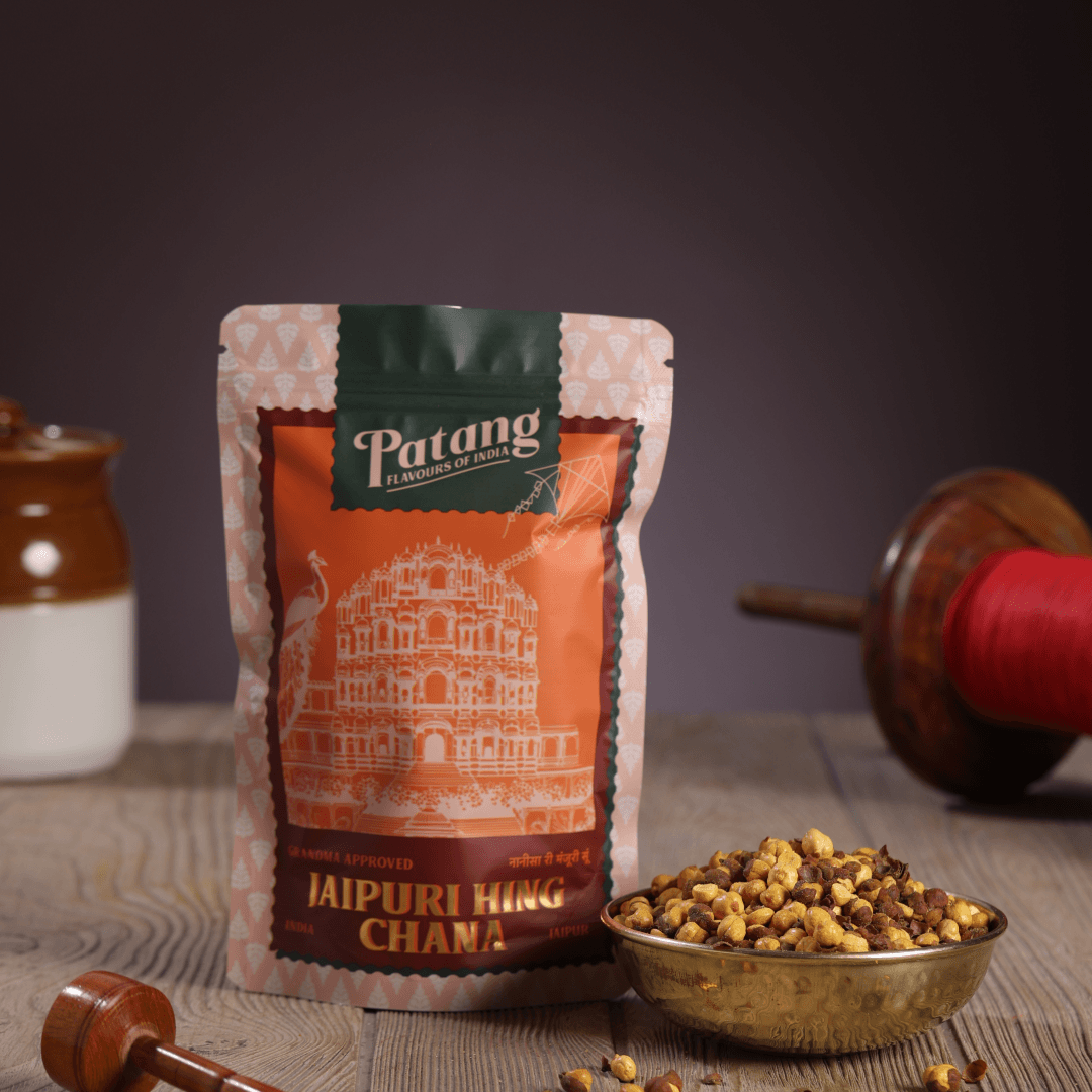 Patang Jaipuri King Chana packaging with a bowl of chana on a wooden surface.