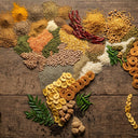 Map of India made from various spices and grains on a wooden surface