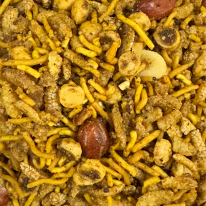 Close up of crunchy Bengali chanachur namkeen showing roasted peanuts and chana dal, a perfect healthy tea time snack