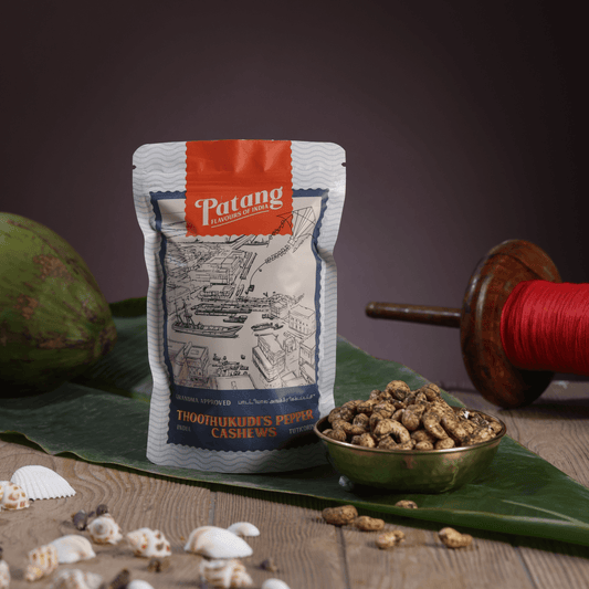 Patang cashew package with cashews on a leafy background